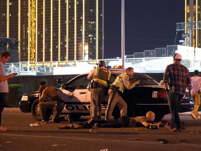 Las Vegas police stand guard along the streets outside the Route 91 Harvest country music festival. Picture: David Becker/Getty