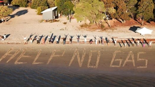 Couran Cove Island Resort residents pleaded for the state government to step in to help them, writing this message in the sand, after their gas was disconnected in 2021. Picture: supplied