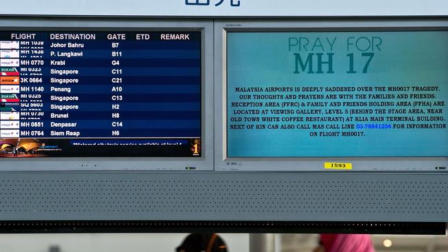 A flight information screen displaying a solidarity message for Malaysia Airlines flight MH17 at Kuala Lumpur International Airport in Sepang. Picture: Afp