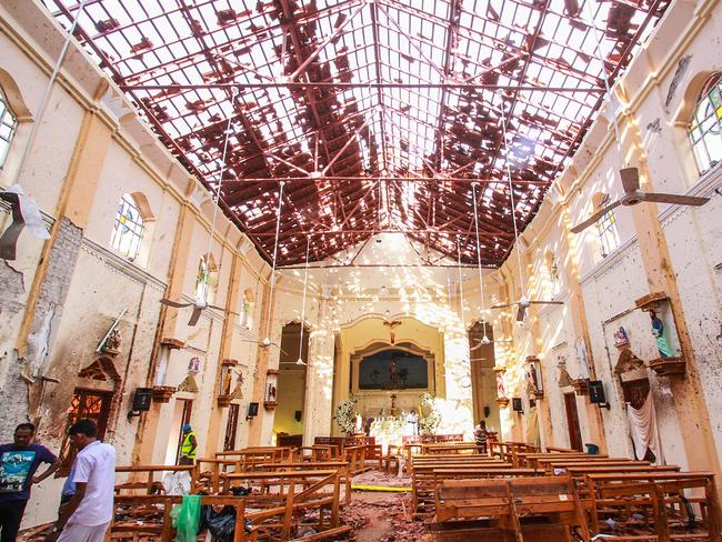 Sri Lankan officials inspect St Sebastian’s Church in Negombo, north of Colombo. Picture: Getty 