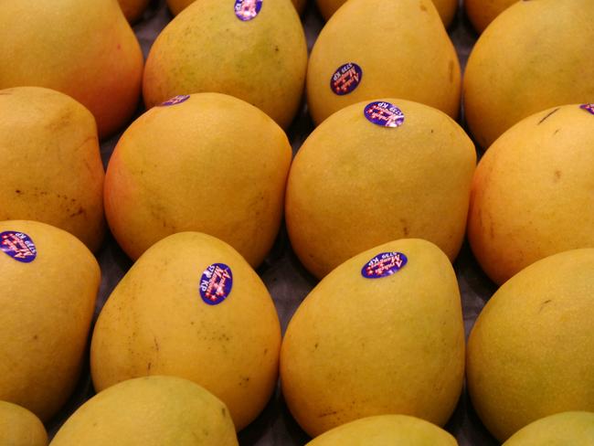 Kensington pride mangoes. Fruit and vegetables on display in the new-look fresh produce section at a Woolworths supermarket.