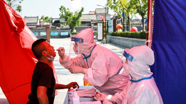A man undergoes Covid testing in Huaian, in eastern China's Jiangsu province, as China raced to contain its worst coronavirus outbreak in months. Picture: AFP