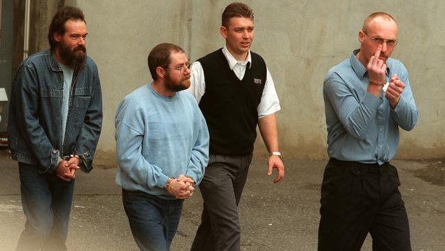 Snowtown killers Mark Haydon (left), John Bunting (second left), a court official and Robert Wagner (right).