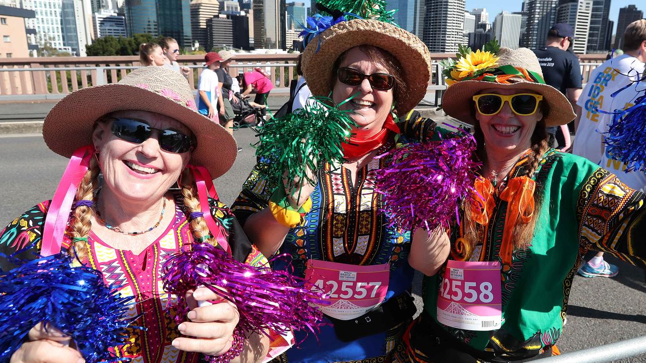 Sisters Marion Tunn of Everton Park, Jackie McLachlan of Ormiston, and Natalie Buss of Mt Tambourine, 5 Km race, Bridge to Brisbane, Story Bridge, Kangaroo Point. Photographer: Liam Kidston.