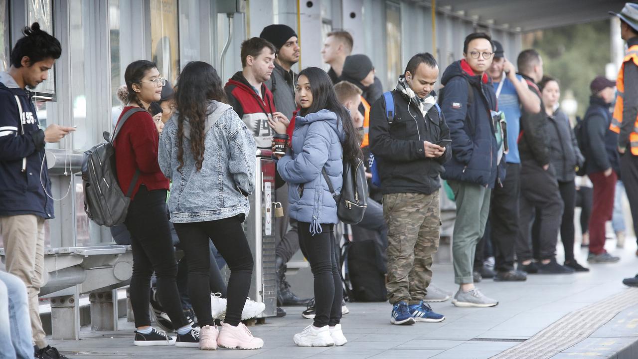 Dr Swan said if Canberra had mandated mask wearing weeks ago Victorians (above in Melbourne on June 23) might have been better protected. Picture: David Caird