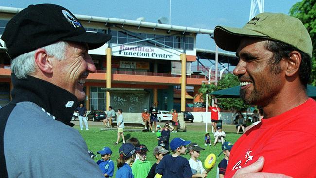 Coach Mick Malthouse shakes hands with former Eagle Chris Lewis. Collingwood's post-split round (Round 12) trip to Darwin.