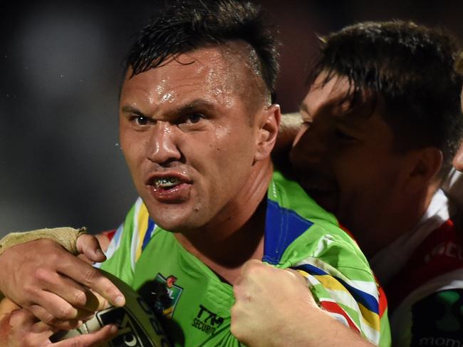 Jordan Rapana (left) of the Raiders is tackled by Michael Cooper and Gareth Widdop of the Dragons during the round 10 NRL match between the St George Illawarra Dragons and the Canberra Raiders at WIN Jubilee Oval in Sydney on Thursday, May 12, 2016. (AAP Image/Paul Miller) NO ARCHIVING, EDITORIAL USE ONLY