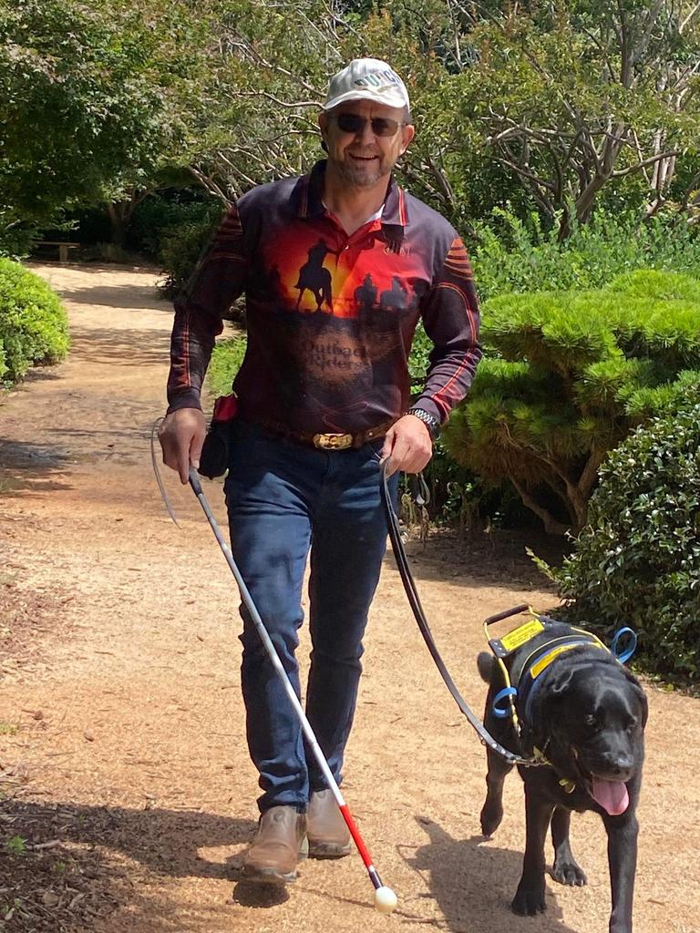 Michael Cooper was the first person in Australia to receive NDIS funding for his guide dog, Cody.