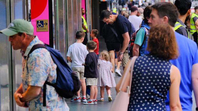 Some families did still stop to see the latest edition of the windows on Sunday morning. Picture: NewsWire / Luis Enrique Ascui