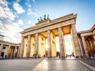 Brandenburg gate at sunset with solar flare, Berlin