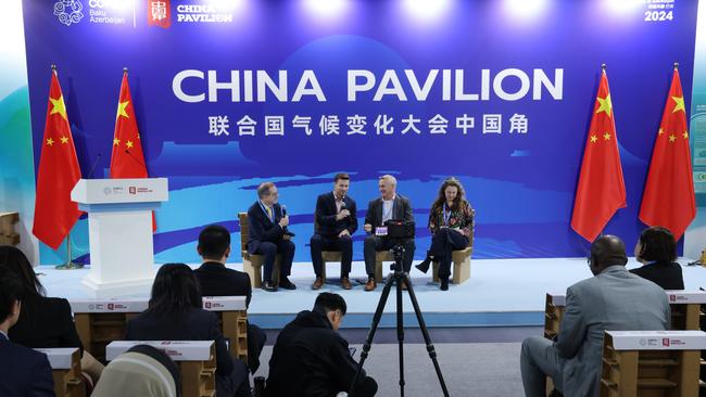 COP participants attend a panel discussion at the China pavilion on day six at the COP29 climate conference.