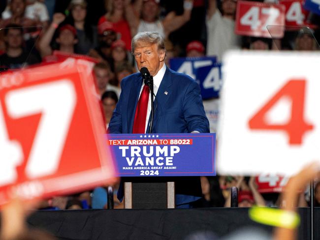 (FILES) Former US President and Republican presidential candidate Donald Trump speaks during a campaign rally at Mullet Arena in Tempe, Arizona on October 24, 2024. Donald Trump won the state of Arizona in this week's US presidential election, US TV networks projected on November 9, 2024, completing the Republican's sweep of all seven swing states. (Photo by Rebecca NOBLE / AFP)