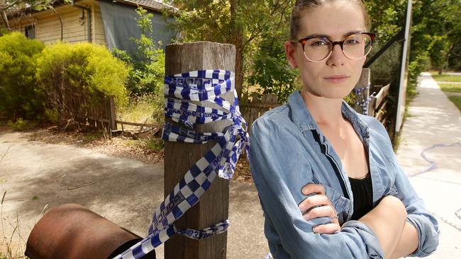 Eliza Griffiths is fed up with ongoing anti-social behaviour and tagging at abandoned houses in Anzac St and Gallipoli Pde, Croydon. Picture: Norm Oorloff