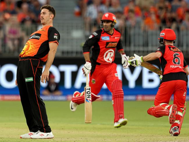 Mitchell Marsh (left) of the Scorchers reacts to a missed catch as Mohammad Nabi (centre) and Sam Harper of the Renegades run between the wickets. Picture: AAP Image