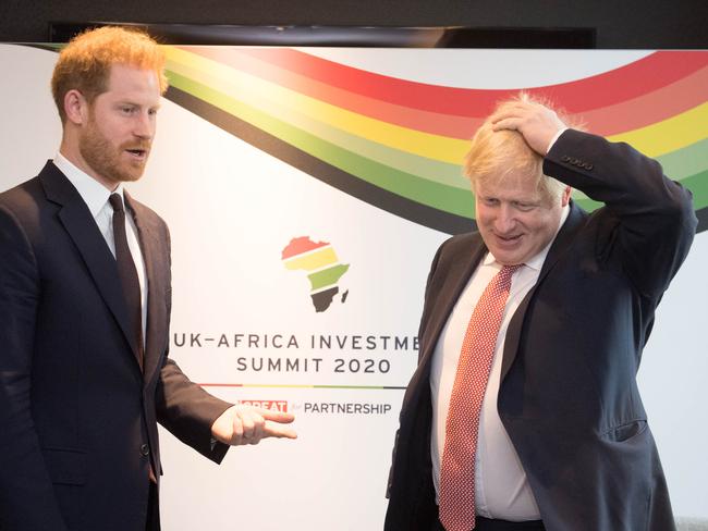 Prince Harry speaks with British Prime Minister Boris Johnson as they attend the UK-Africa Investment Summit in London. Picture: Getty