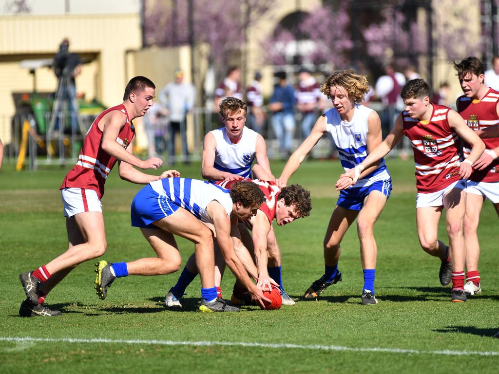 Prince Alfred’s Wil Bromley battles a St Peter’s opponent for the ball. Picture: AAP/ Keryn Stevens.