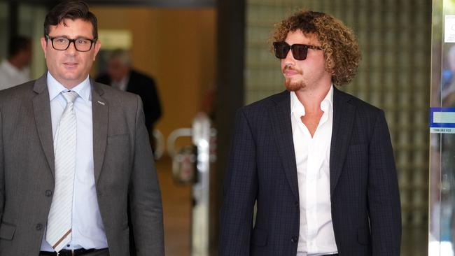 Daniel Taylor (right) leaves the Downing Centre Local Court. Picture: AAP