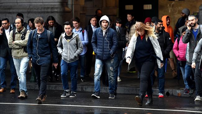 Cold commute: it was wet and blustery this morning in Melbourne’s CBD. Picture: Nicole Garmston