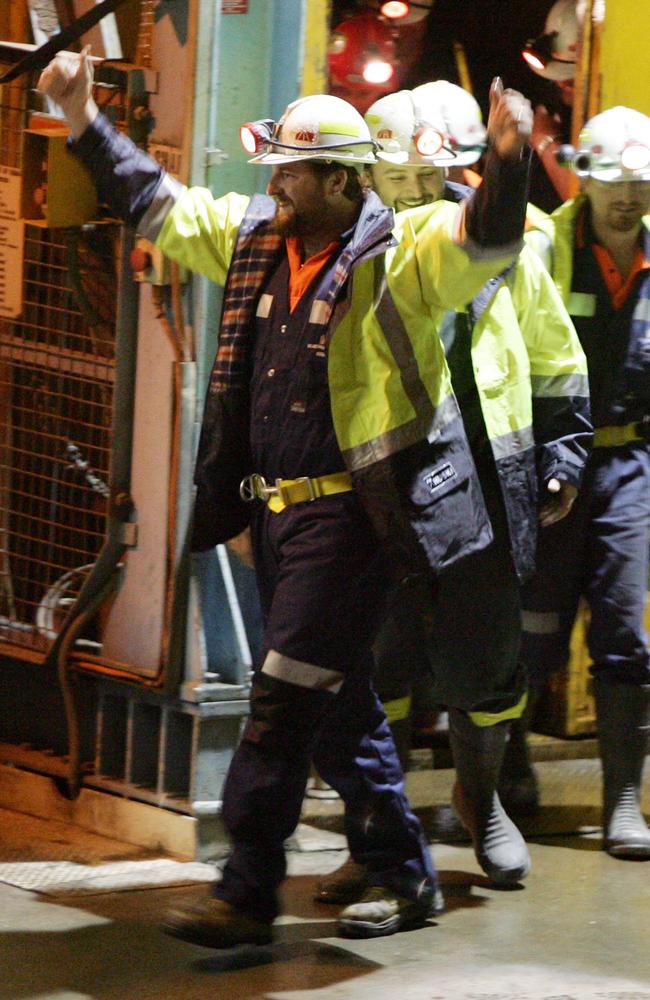 MAY 9, 2006: Rescued miners Todd Russell (front) and Brant Webb wave as they walk from lift after they were rescued 13 days after being caught in cave-in 1000 metre underground at Beaconsfield Gold Mine in Northern Tasmania, 09/05/06. Tasmania / Industry / Mining / Accident