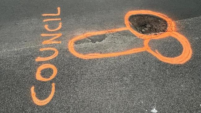 A road vandal has spray painted around a pothole on Ullathornes Rd in Inverloch, after being tired of not seeing it repaired. Not long later, the pothole was repaired. Picture: Facebook/Nikki Kelly