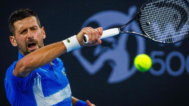 Serbiaâs Novak Djokovic hits a return during the menâs singles match against Australiaâs Rinky Hijikata at the Brisbane International tennis tournament in Brisbane on December 31, 2024. (Photo by Patrick HAMILTON / AFP) / -- IMAGE RESTRICTED TO EDITORIAL USE - STRICTLY NO COMMERCIAL USE --