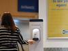 MILTON KEYNES, ENGLAND - JUNE 01: Members of the public use hand sanitiser next to a sign saying 'great to see you again' as they enter Milton Keynes Ikea on the first day of reopening on June 01, 2020 in Milton Keynes, England. The furniture and housewares chain reopened its stores across England and Northern Ireland subject to several restrictions, keeping its restaurants closed and asking customers to shop alone. (Photo by Catherine Ivill/Getty Images)