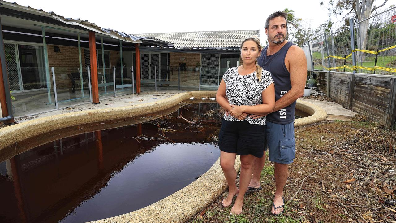 Grant and Jess Goding at their Helensvale home which was badly damaged by the Christmas Day storms. Pics Adam Head