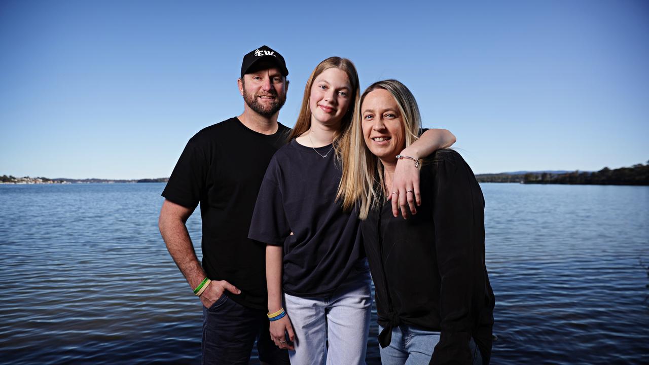 Double lung transplant recipient Ruby Payne, 12, in Newcastle with her parents Robbie Payne and Melanie Streeter. Picture: Adam Yip