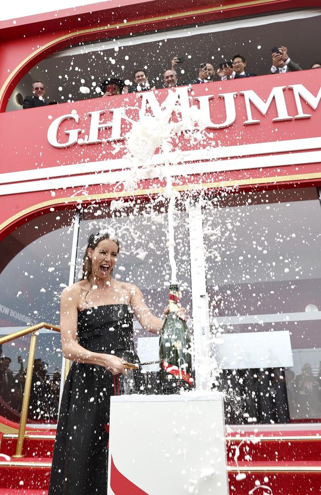 ... and cops a drenching. Picture: Getty Images