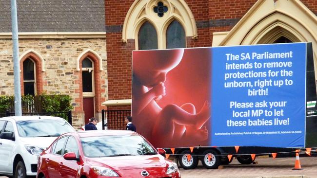 The political billboard in front of Queen of Angels Catholic Church, corner of South Rd and Kintore St, Thebarton, SA. Picture: Michael Hall