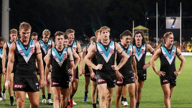 Port players walk off the Adelaide Oval after a shock loss to Hawthorn. Picture: Getty Images