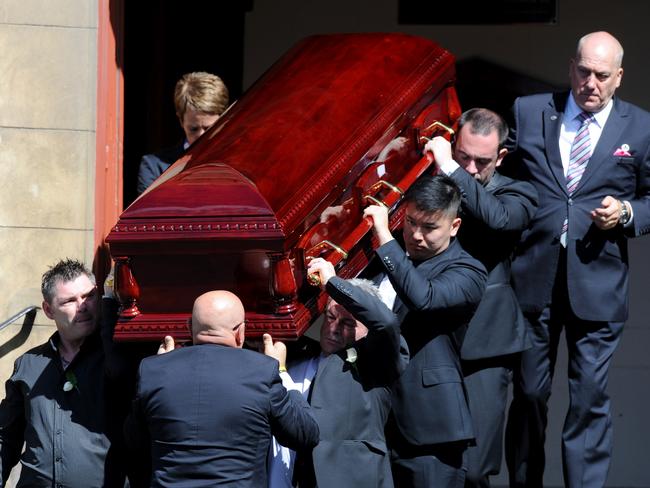 Karen Ristevski’s coffin is carried from the Essendon church. Her brother, Stephen Williams (front left) and husband, Borce Ristevski (front right), were among the six pallbearers. Picture: AAP