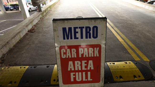 Familiar sign: The Sunbury station rooftop carpark sign goes up early in the morning, as streets around town are also clogged.