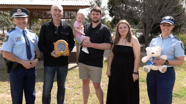 Reunited with Lily from left to right: Superintendent Darrin Batchelor, Greg Page (from Heart Of The Nation Foundation), Lily McGowan, Lewis McGowan, Sam McGowan, Senior Constable Nicole Ziedan.