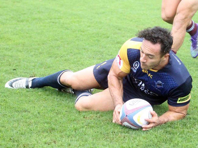 Round 2 Queensland Premier Rugby match between Bond University (blue) and University of Queensland. Photo of try scorer Corbin Kiernan. Photo by Richard Gosling