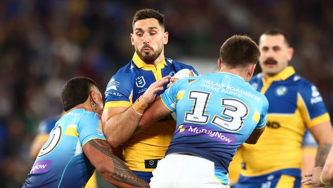 GOLD COAST, AUSTRALIA - JULY 13: Ryan Matterson of the Eels is tackled during the round 19 NRL match between Gold Coast Titans and Parramatta Eels at Cbus Super Stadium, on July 13, 2024, in Gold Coast, Australia. (Photo by Chris Hyde/Getty Images)