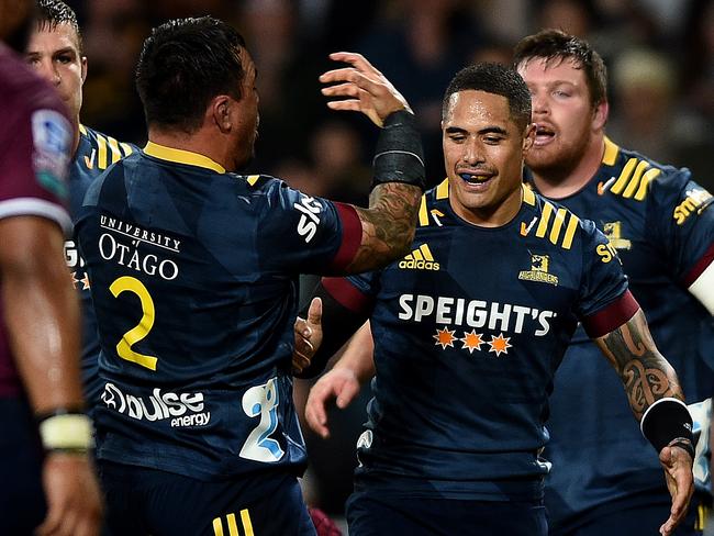 DUNEDIN, NEW ZEALAND - MAY 14: Ash Dixon of the Highlanders celebrates scoring a try during the round one Super Rugby Trans-Tasman match between the Highlanders and the Queensland Reds at Forsyth Barr Stadium on May 14, 2021 in Dunedin, New Zealand. (Photo by Joe Allison/Getty Images)