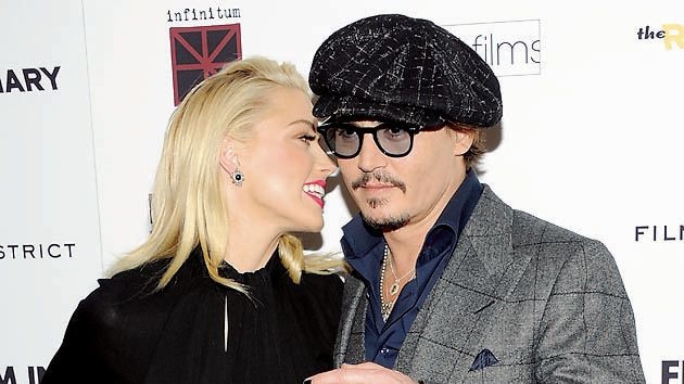 Heard and Depp attend the premiere of "The Rum Diary" at the Museum of Modern Art on Tuesday, Oct. 25, 2011 in New York. (AP Photo/Evan Agostini)