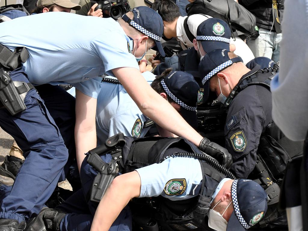 Police officers involved in a scuffle with protesters at Victoria Park. Picture: Matrix