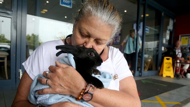 Donna Luck with her rabbit at the evacuation centre in Laurieton. Picture: Nathan Edwards