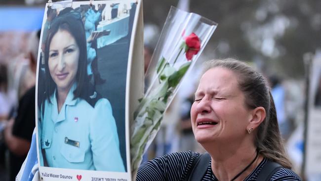 A woman breaks down in grief at the anniversary memorial to Yulia Waxer Daunov at the site of the Nova Festival. Picture: Getty Images