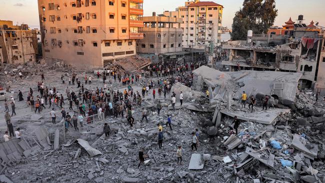 People search rubble for survivors and the bodies of victims in the aftermath of Israeli bombardment in Rafah in the southern Gaza Strip on Monday. Picture: AFP