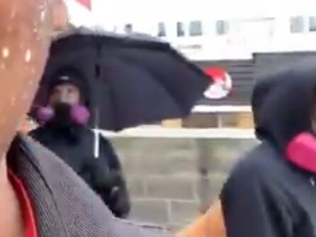 Umbrella Man tries to blend into the crowd. Picture: Twitter