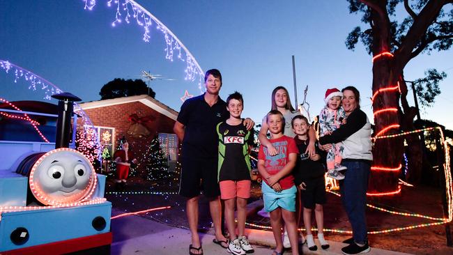 Chris Smith, Noah, 11, Austin, 9, Cassidy, 15, Cameron, 9, Marley, 2, and Megan Smith with their Thomas the Tank Engine display in Flagstaff Hill. Picture: AAP/Morgan Sette