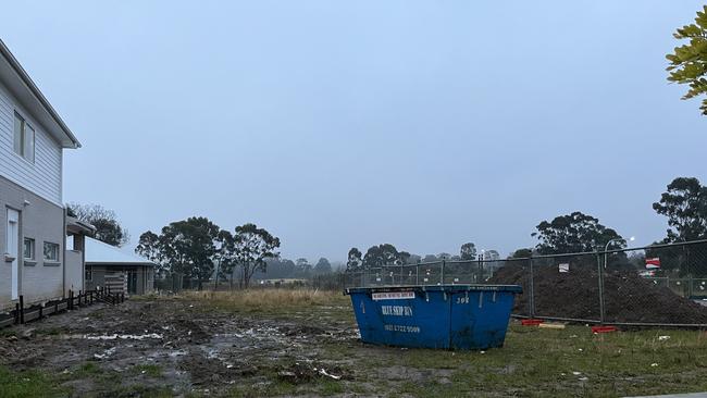 What the couple’s property looks like after a year and four months since signing the contract. The skip bin is not theirs and has been dumped there.