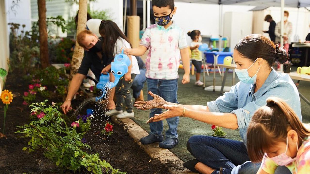 Prince Harry and Meghan Markle getting dirty at the Preschool Learning Center in Los Angeles. Picture: Instagram.