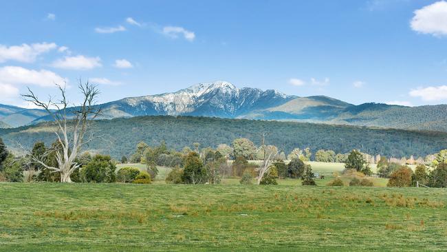 High country offer: The Merrijig farm used as a location for The Man From Snowy River; buildings being constructed on the site in 1982 as ‘Harrison’s Homestead’ took shape, below.