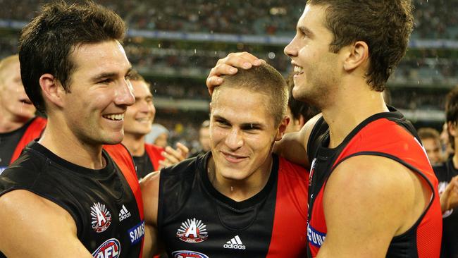 David Zaharakis is mobbed by teammates after his Anzac Day heroics.