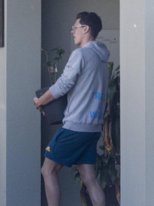 Mitch Larkin packing up his belongings from the house he shared with Emily Seebohm. Picture: AAP/Image Sarah Marshall