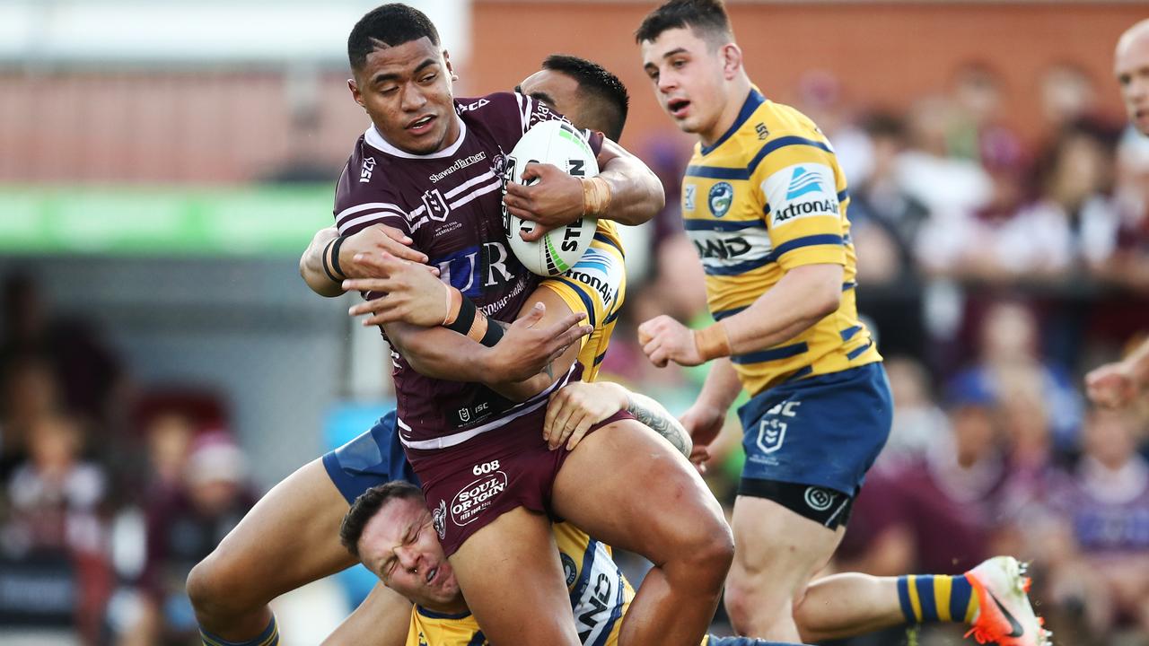 Manase Fainu of the Sea Eagles is tackled by the Eels defence during the Round 18 NRL match between the Manly Sea Eagles and the Parramatta Eels at Lottoland in Sydney, Sunday, July 21, 2019. (AAP Image/Brendon Thorne) NO ARCHIVING, EDITORIAL USE ONLY